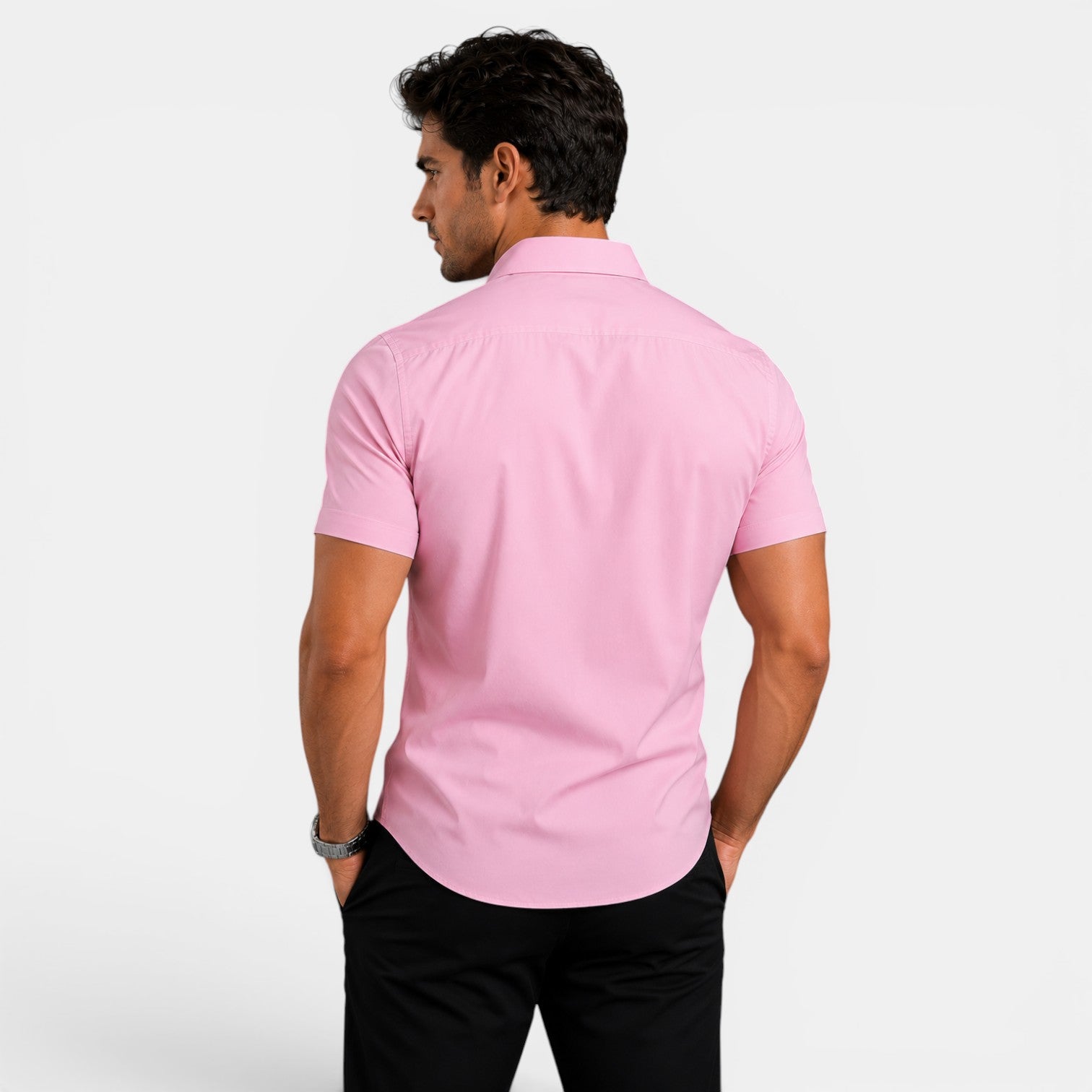Man wearing a pink short-sleeve shirt on a white background