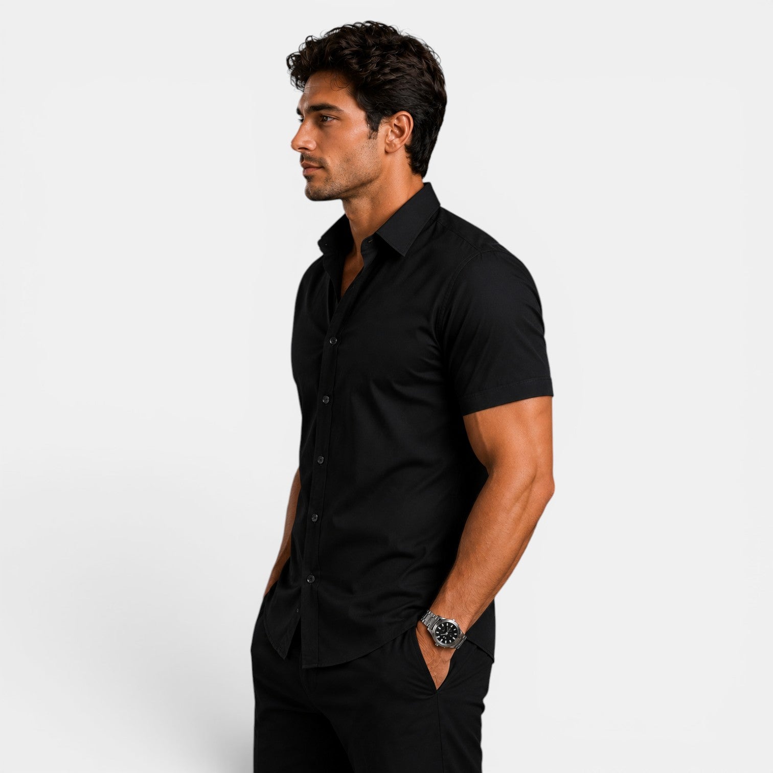 Man wearing a black short-sleeve shirt against a white background