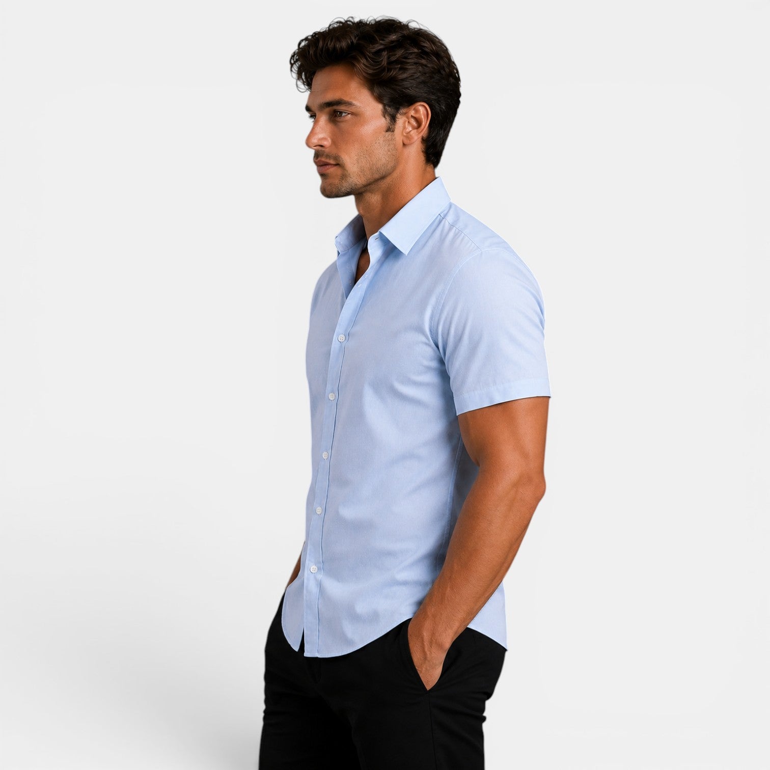 Man wearing a light blue short-sleeve shirt on a white background