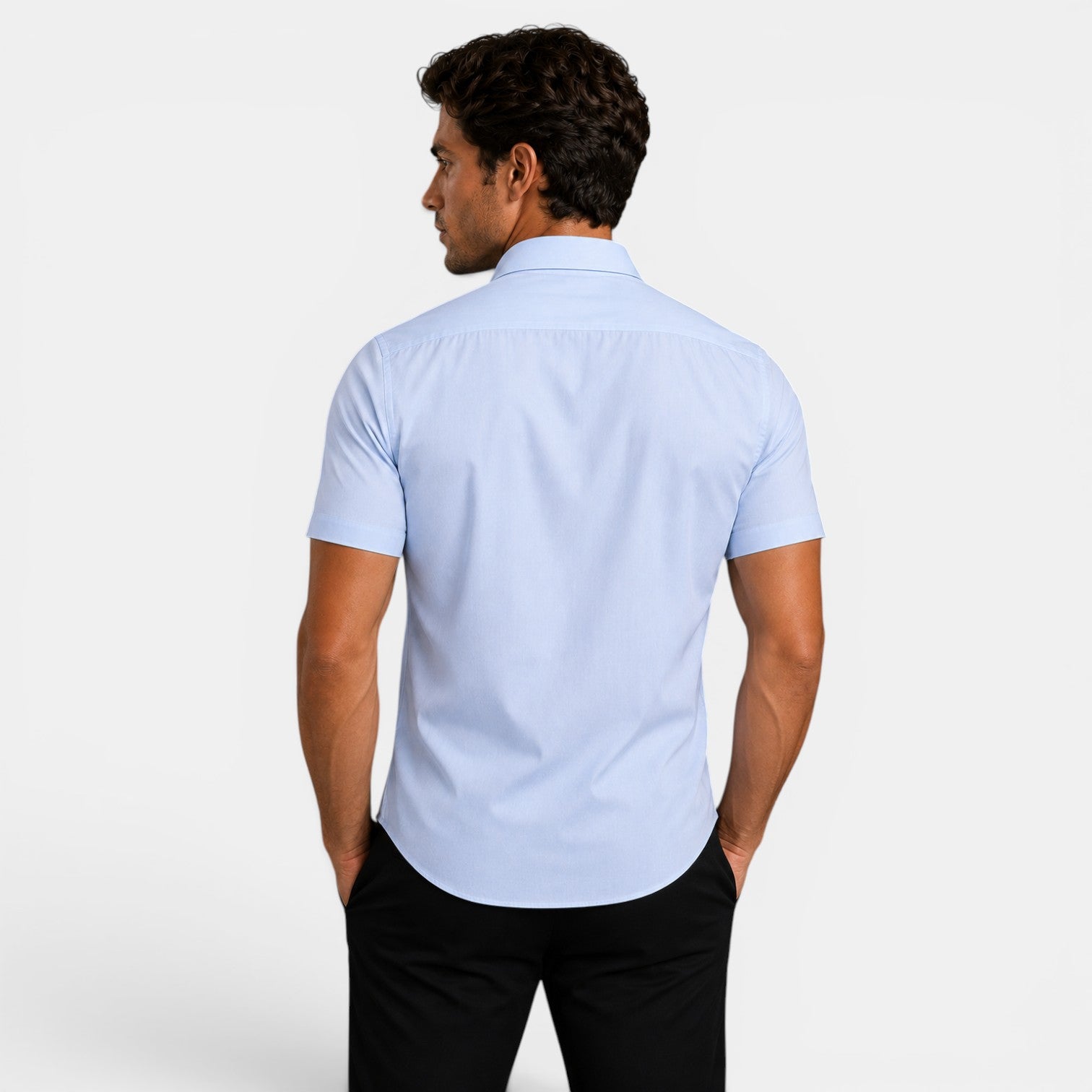 Man wearing a light blue short-sleeve shirt on a white background