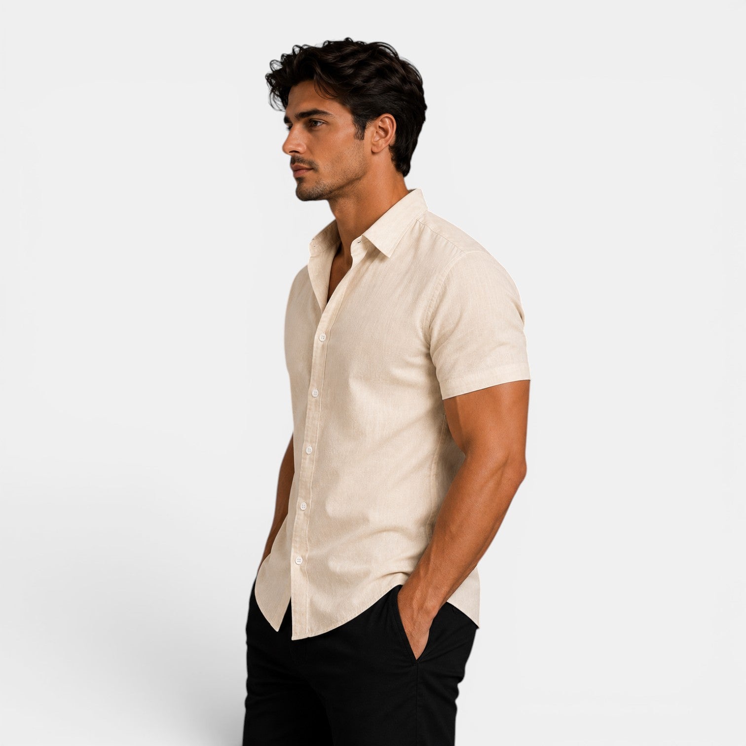 Man wearing a beige short-sleeve shirt against a white background