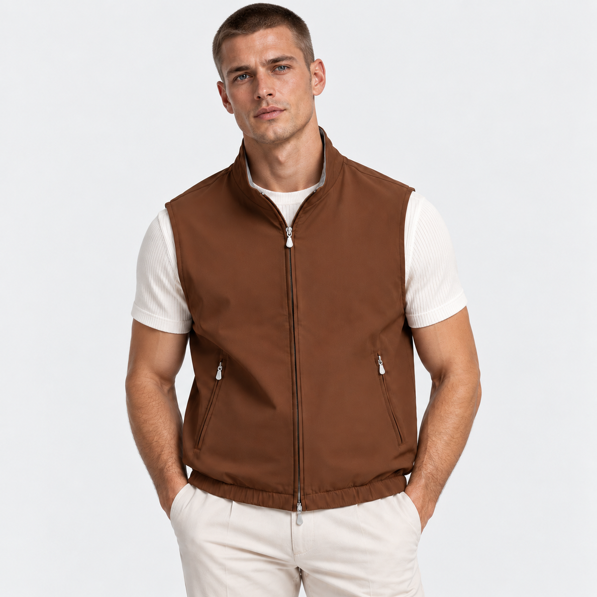 Men's brown zip-up vest styled over a white shirt