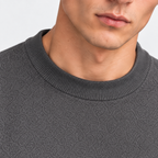 Close-up of men's gray T-shirt with classic crew neckline and textured knit fabric