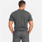 Back view of a man wearing a gray crew neck short sleeve T-shirt