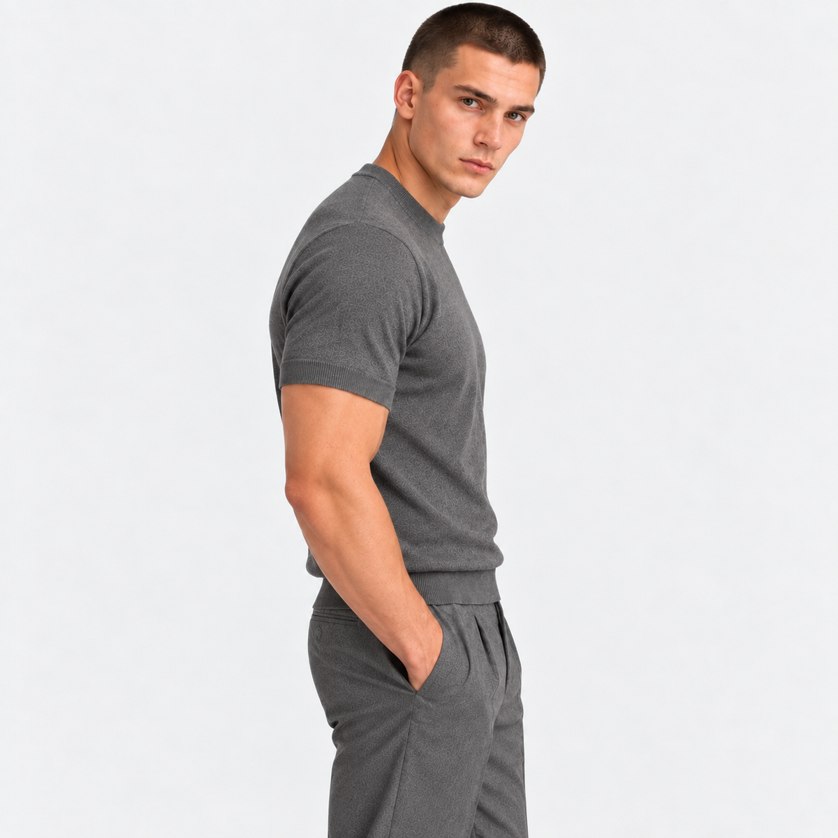 Side view of a man wearing a gray crew neck short sleeve T-shirt