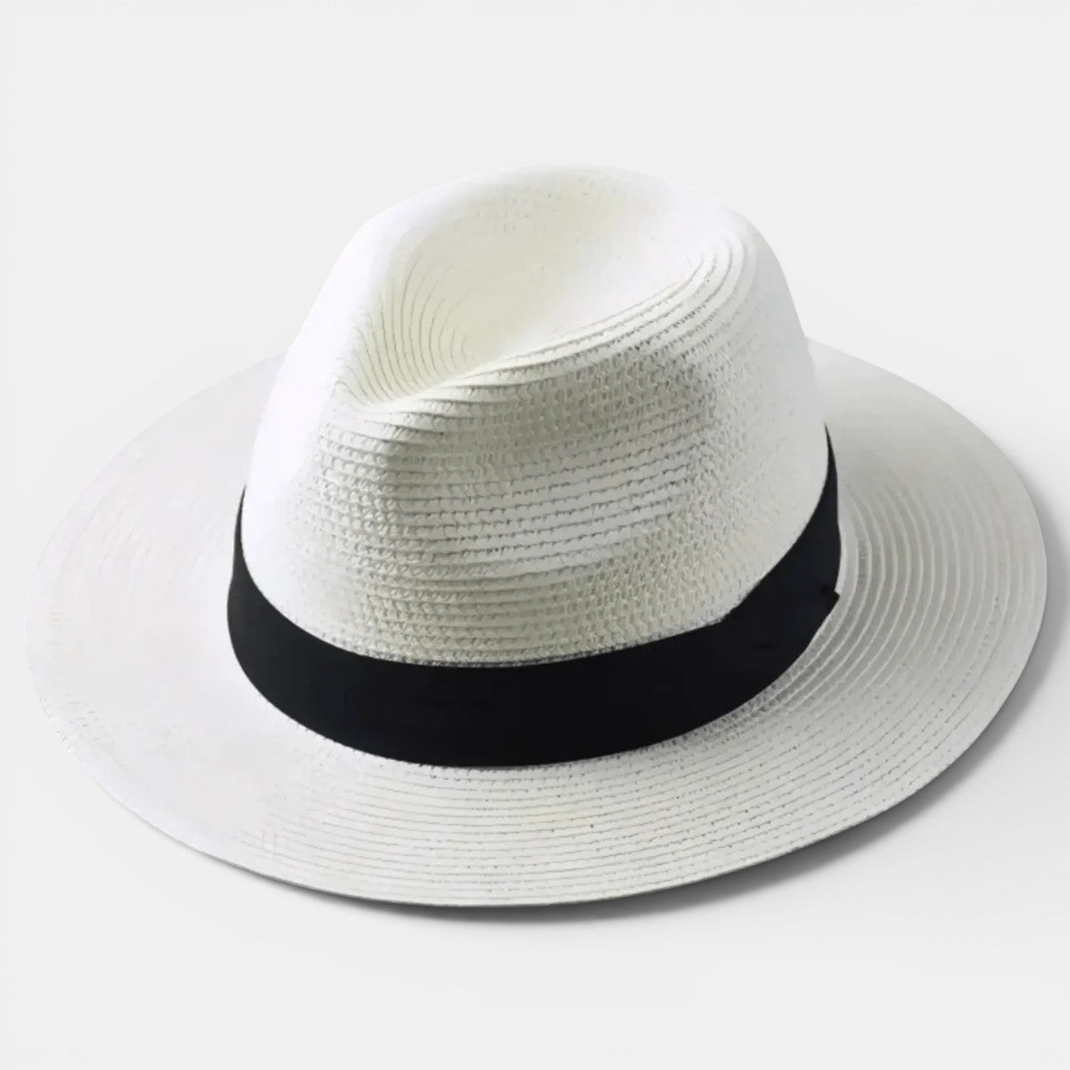 White straw hat with a black band on a light gray background