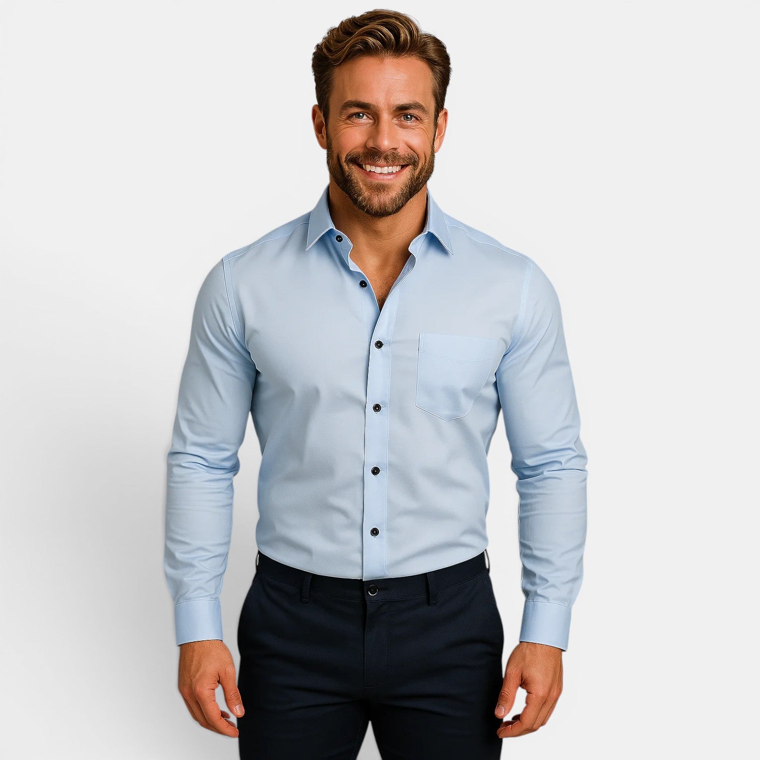 Man wearing a light blue dress shirt and dark pants on a plain background