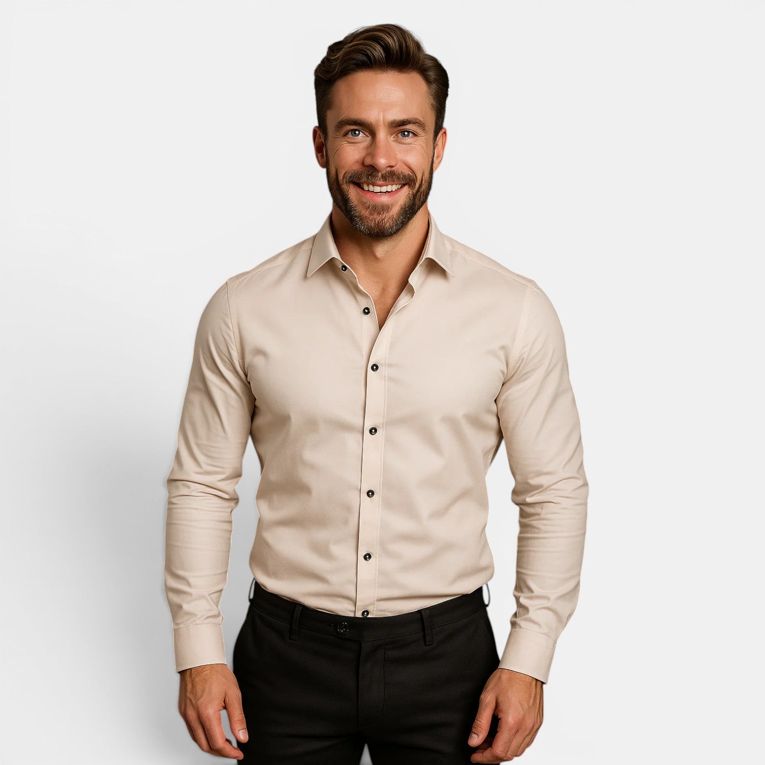 Man wearing a beige dress shirt with black pants on a light gray background