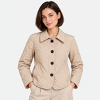 Women's beige quilted jacket with pointed collar, black buttons, and front pockets