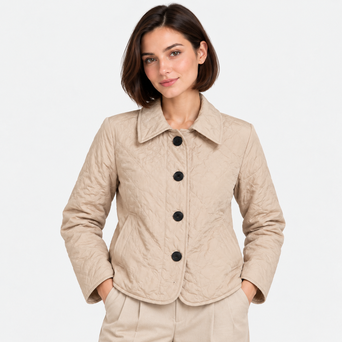 Women's beige quilted jacket with pointed collar, black buttons, and front pockets