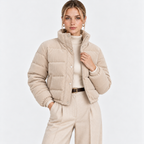Women's beige quilted puffer jacket with high collar, snap buttons, and front pockets
