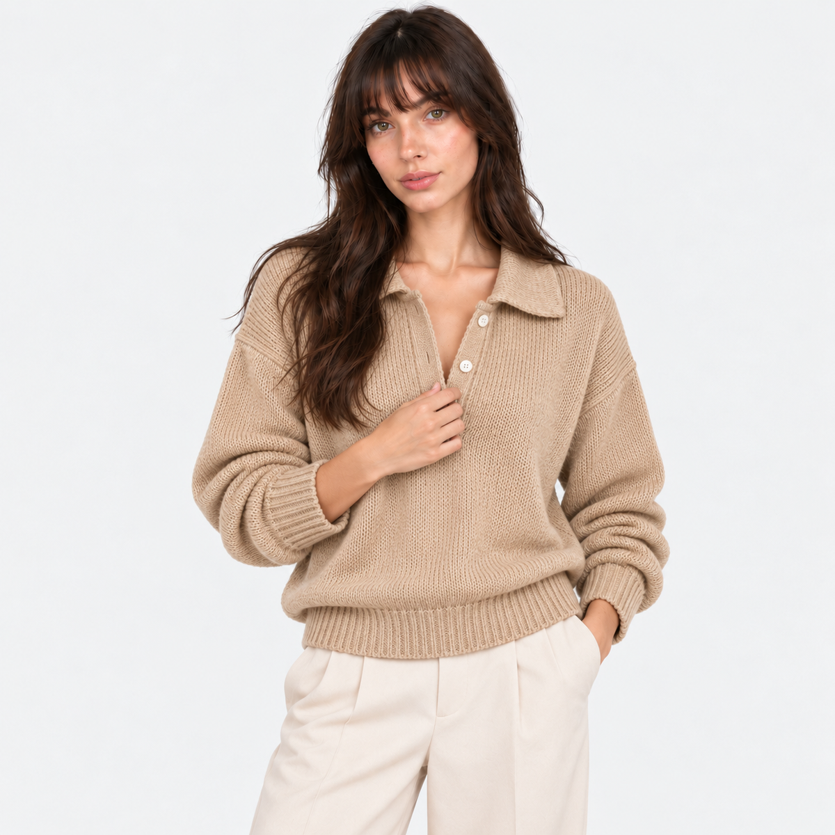 Women's beige knit polo sweater with collared neckline and button placket