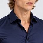 Close-up of men's navy blue button-down shirt with pointed collar and front buttons