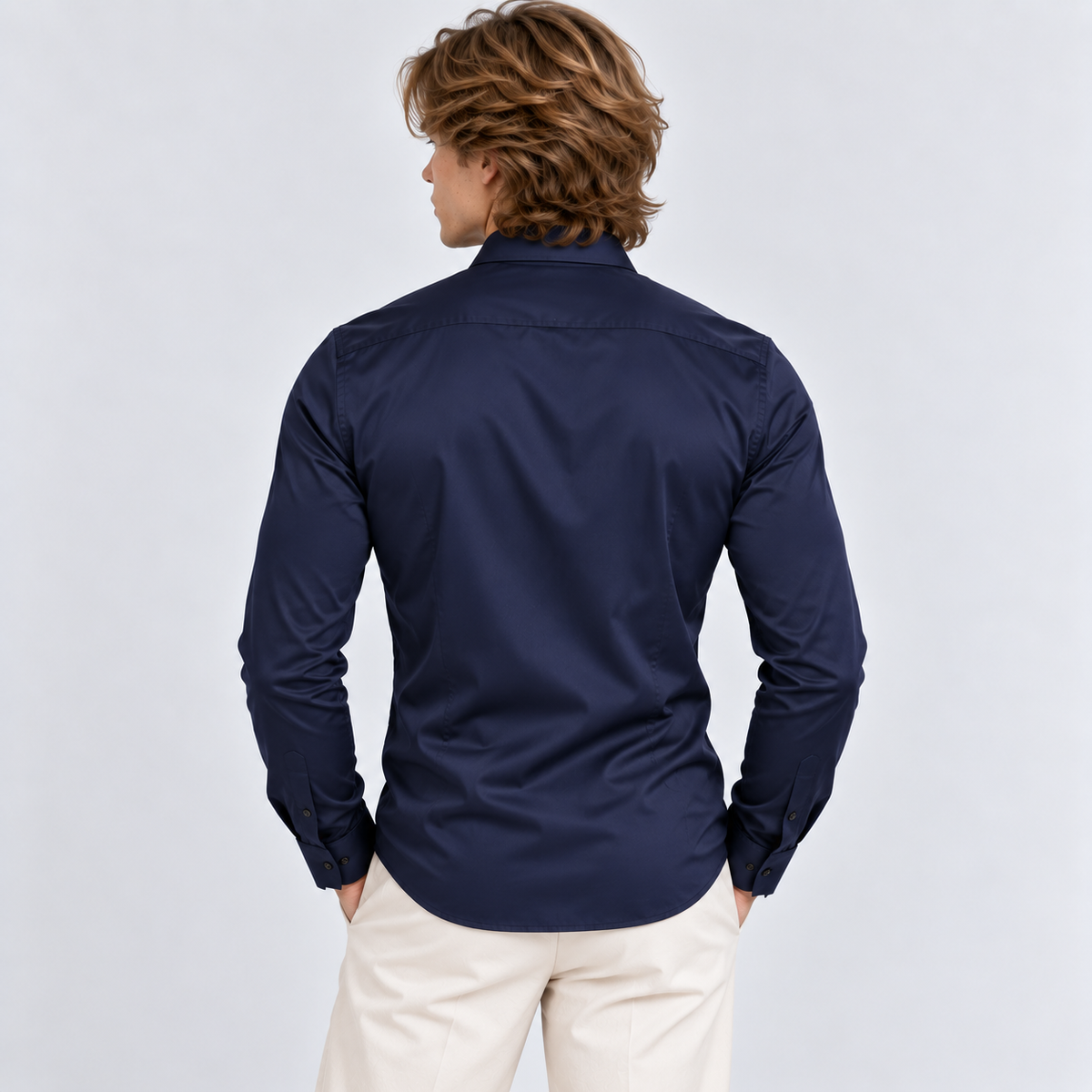Back view of a men's navy blue long sleeve button-down shirt
