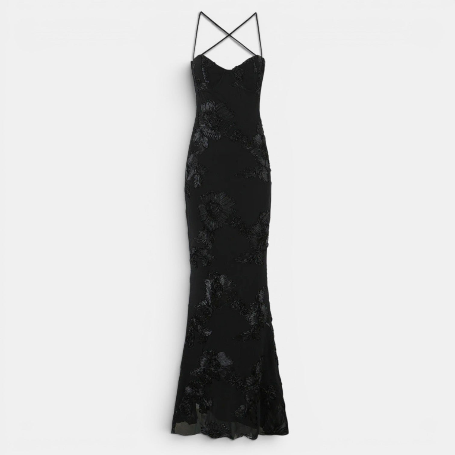 Black lace evening gown with thin straps on a light gray background