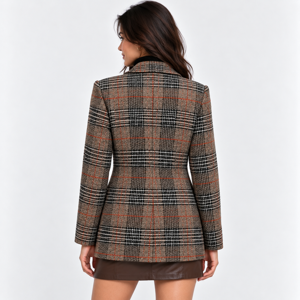 Back view of a woman wearing a brown plaid tailored blazer