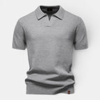Gray patterned polo shirt on a light gray background