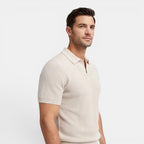 Man wearing a beige short-sleeve shirt on a light gray background