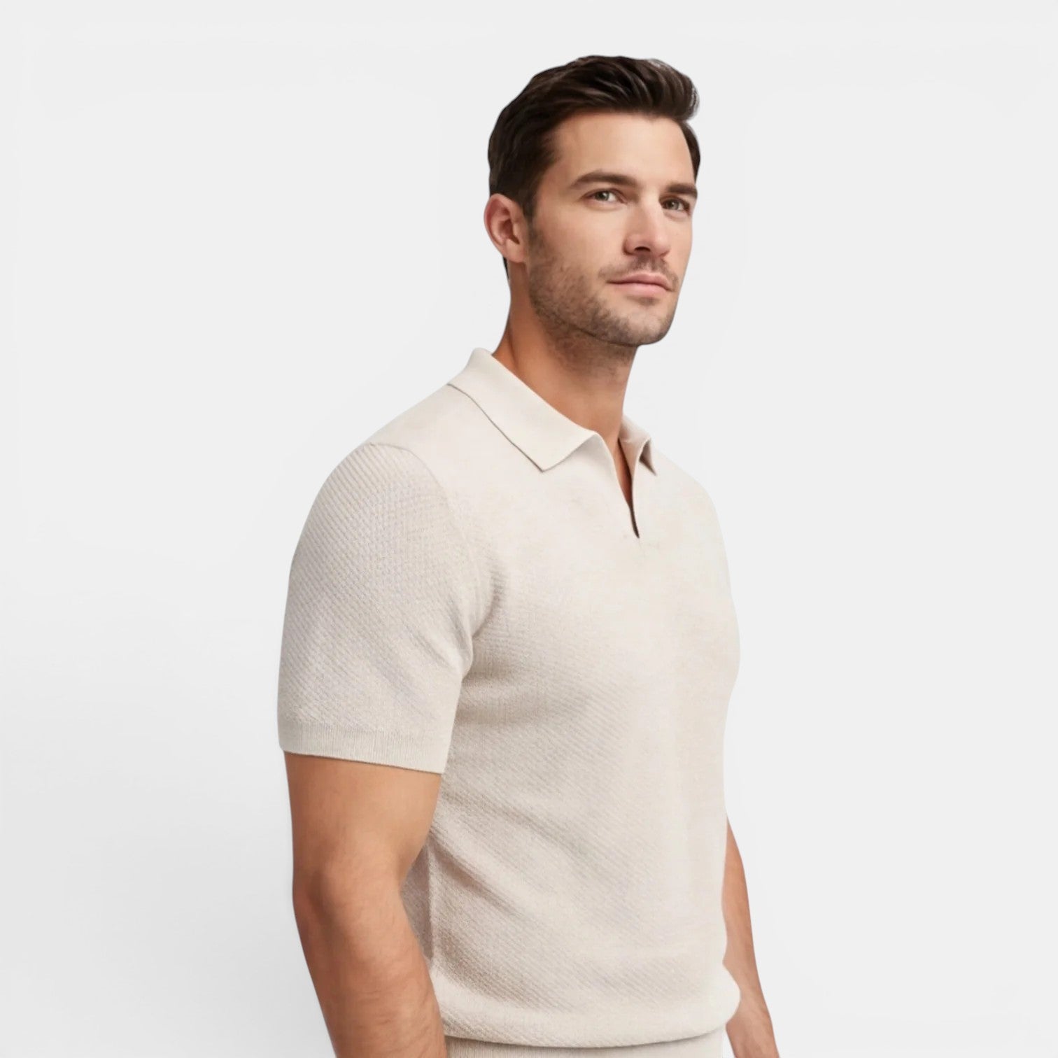 Man wearing a beige short-sleeve shirt on a light gray background