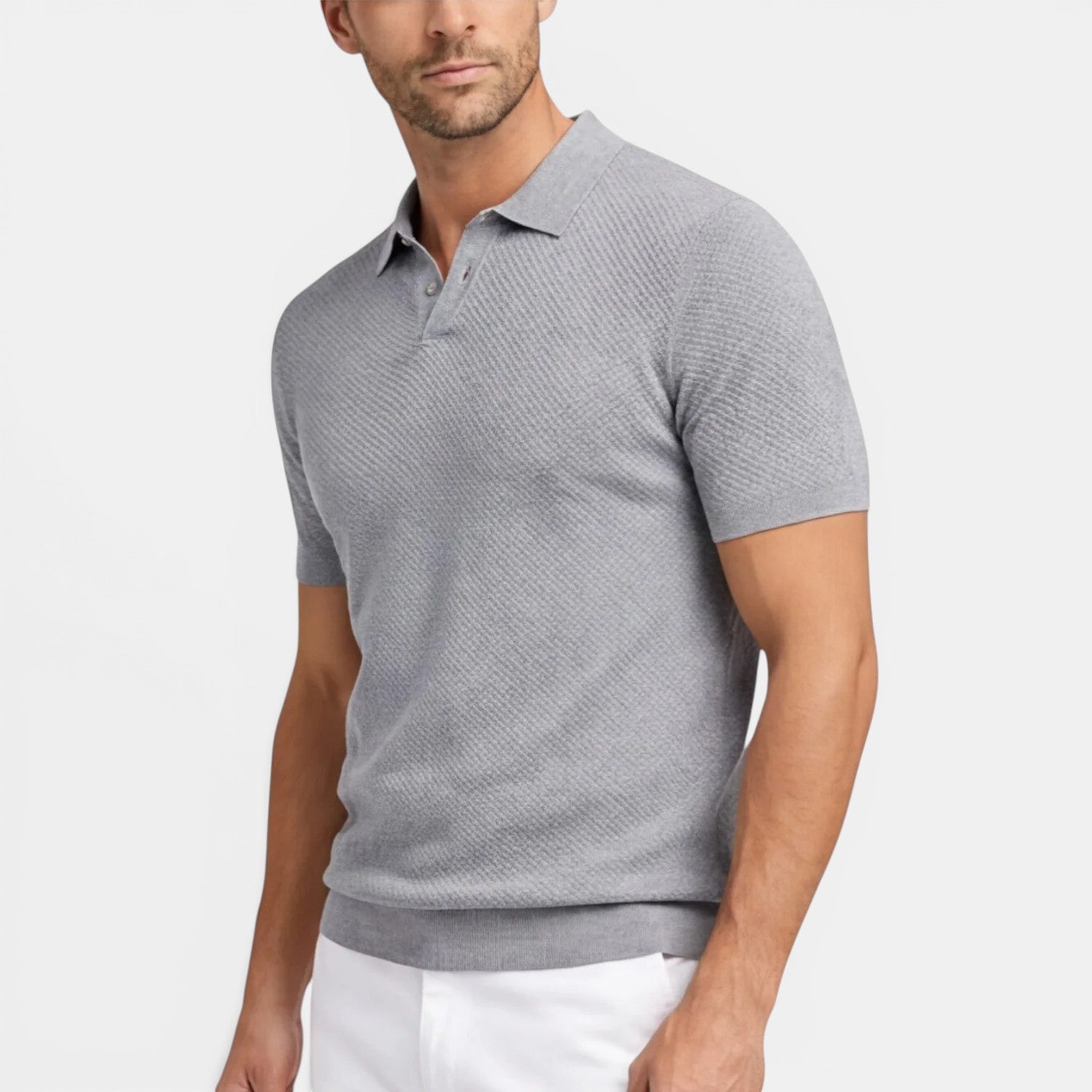 Man wearing a gray patterned polo shirt on a white background