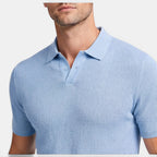 Light blue textured polo shirt worn by a person on a white background