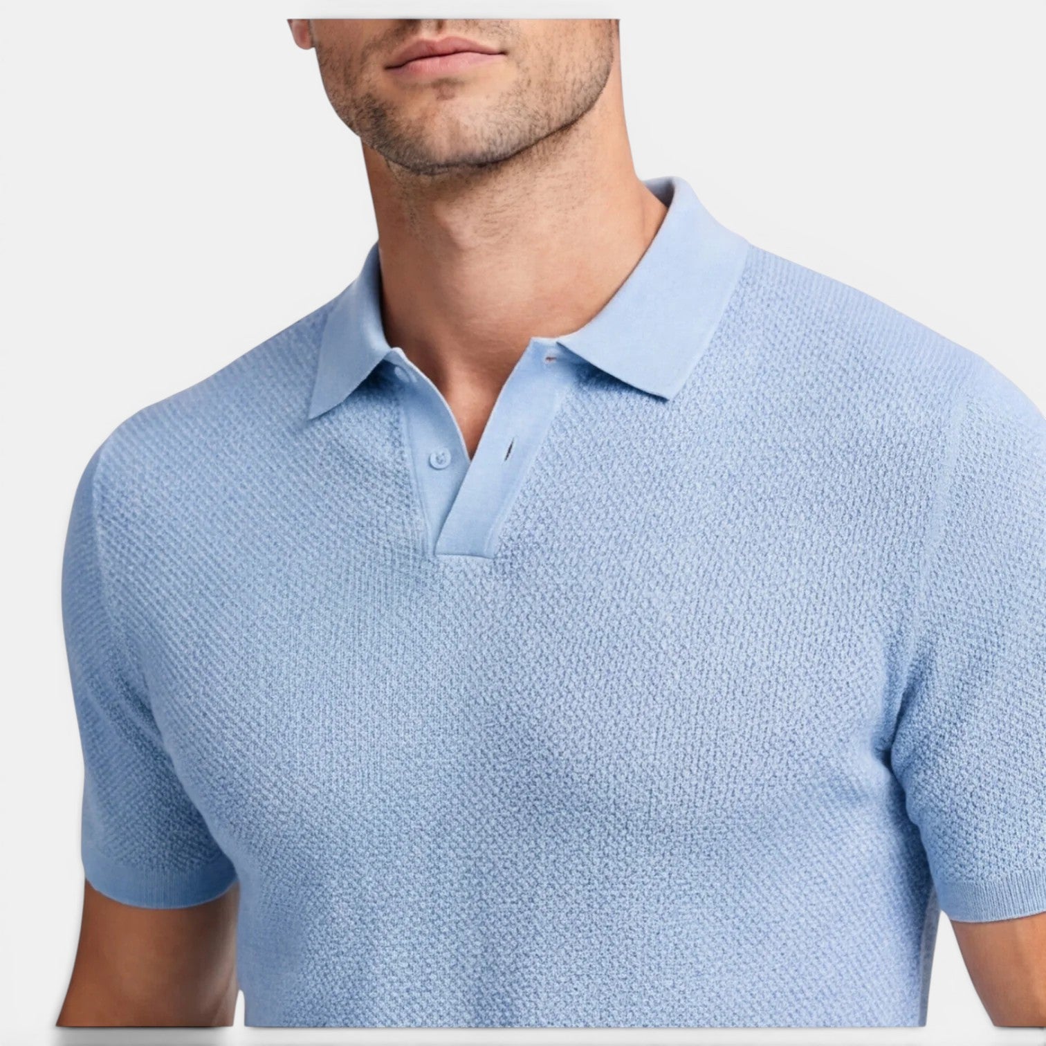 Light blue textured polo shirt worn by a person on a white background