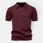 Maroon polo shirt on a light gray background