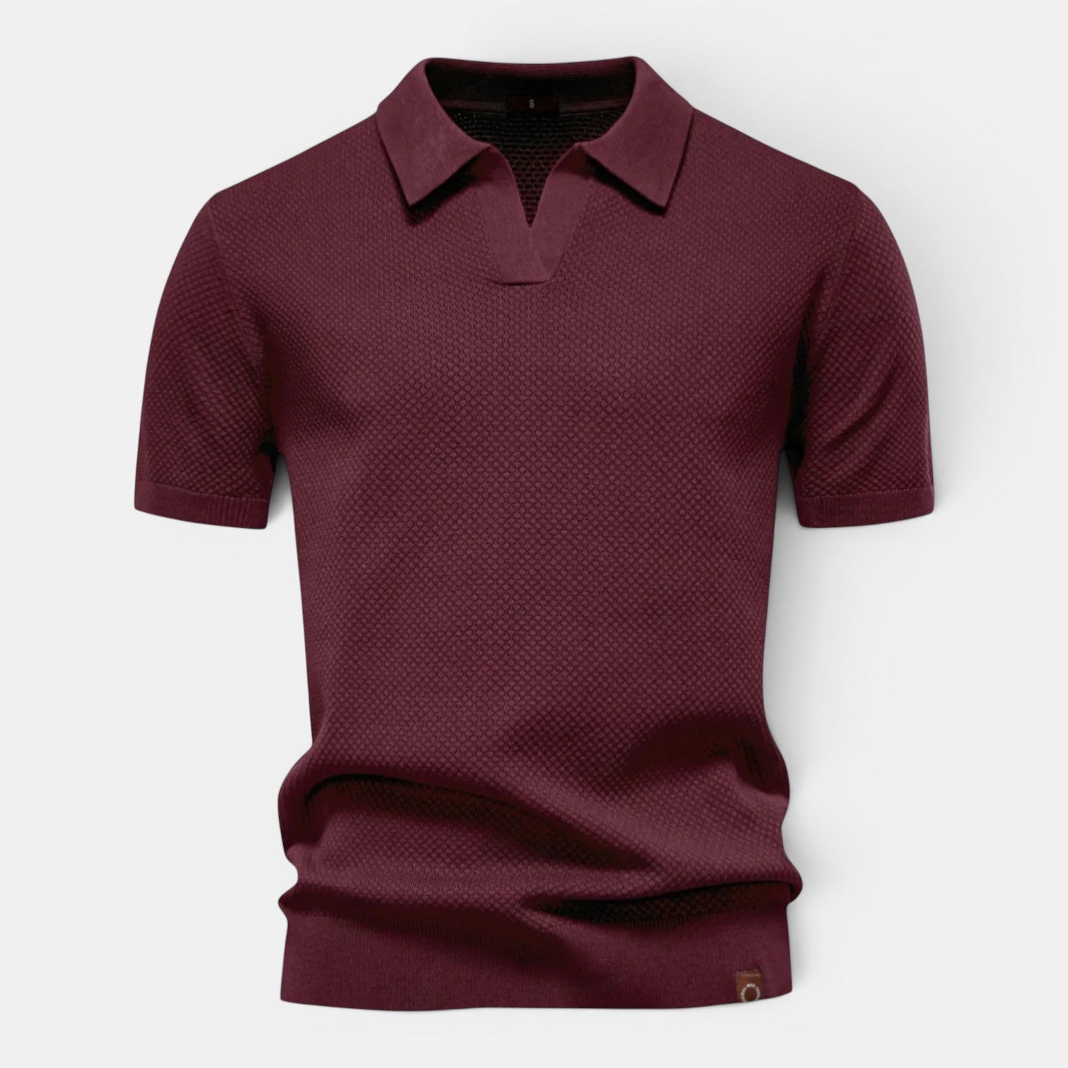 Maroon polo shirt on a light gray background