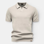 Beige textured polo shirt on a light gray background