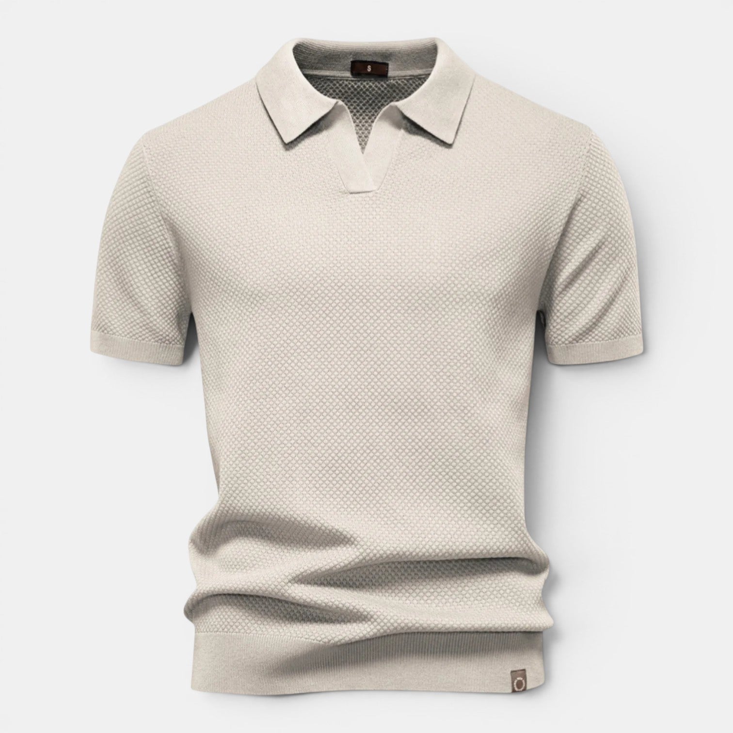 Beige textured polo shirt on a light gray background