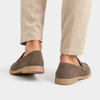 Back view of men's brown suede loafers with flat soles