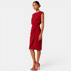 Woman wearing a red dress on a white background
