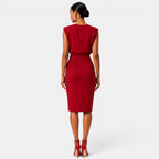 Woman wearing a red dress on a white background
