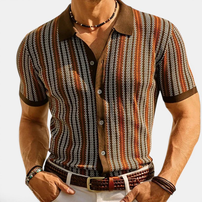 Man wearing a patterned shirt with a collar on a white background