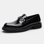 Black shiny loafer shoe on a white background
