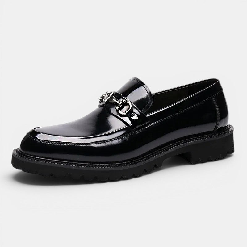 Black shiny loafer shoe on a white background