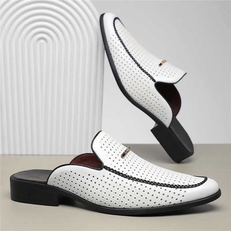 White leather shoes with brown soles on a light gray background