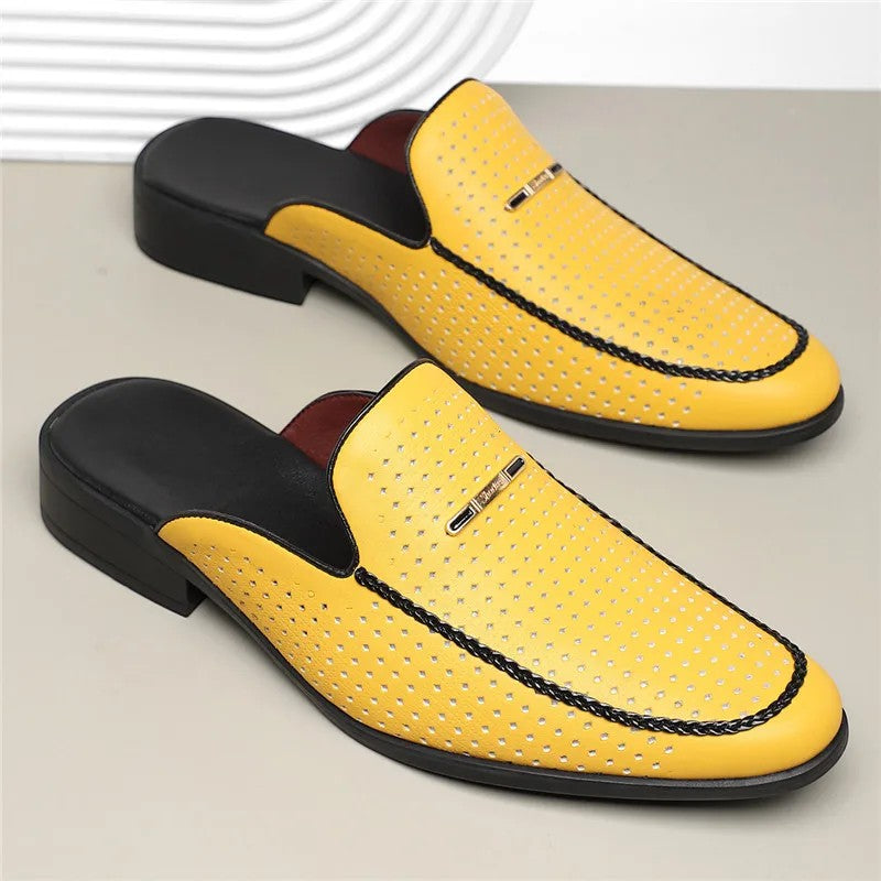 Yellow loafers with black accents on a light gray background