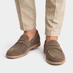 Front view of men's brown suede penny loafers with rounded toes