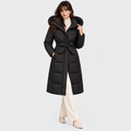 Women's black long puffer coat with faux fur hood trim, waist belt, and front pockets