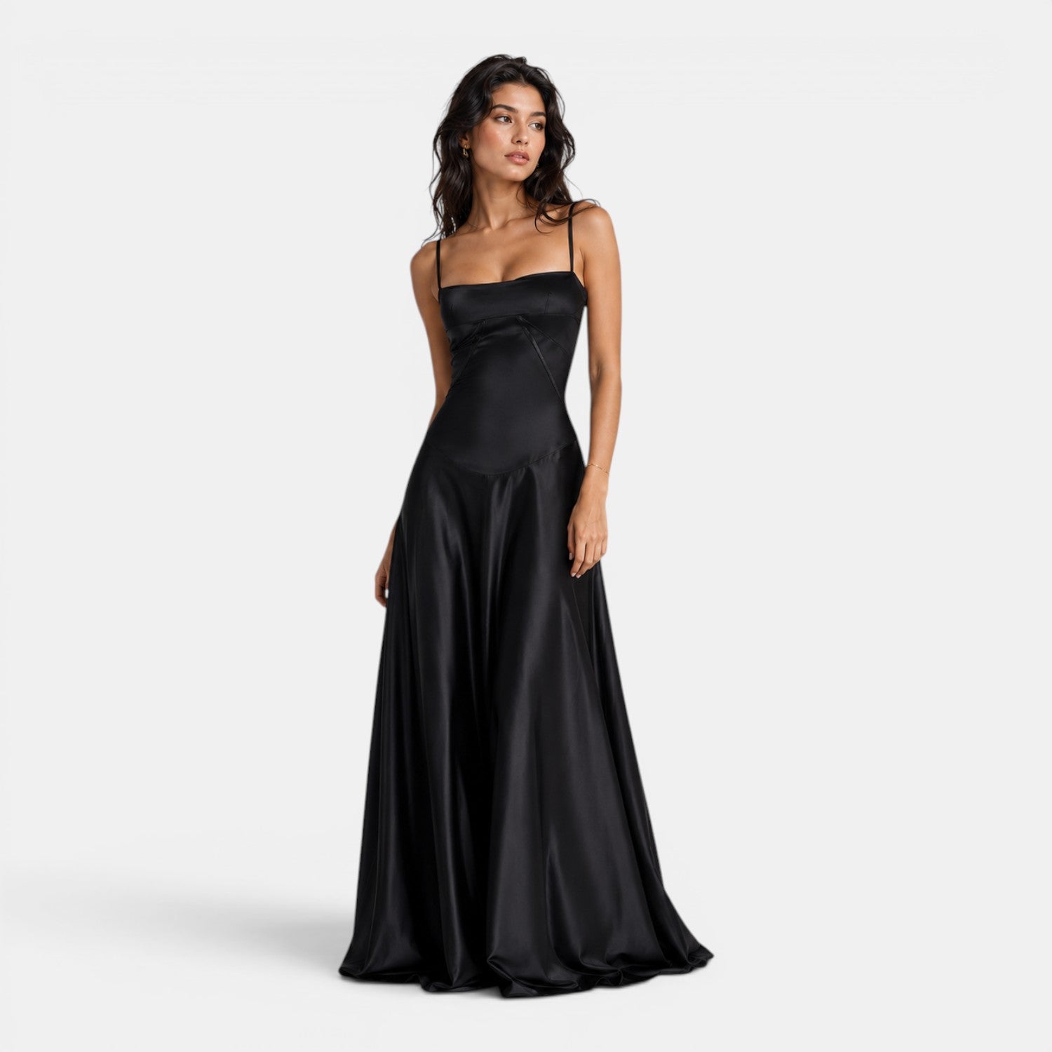 Woman wearing a black satin gown on a white background