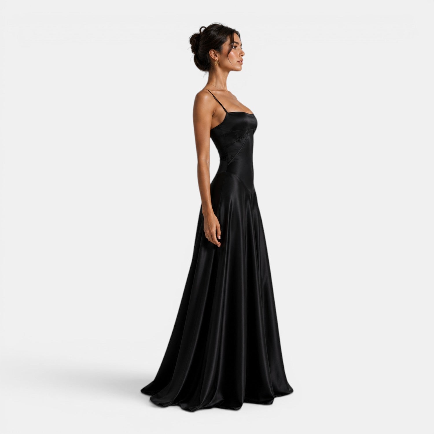 Woman wearing a black evening gown on a white background