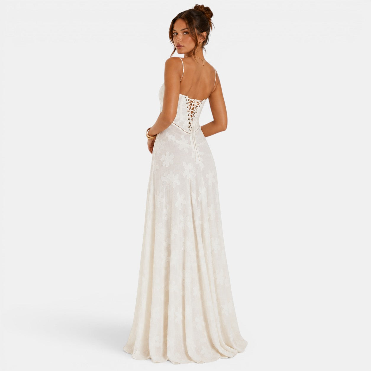 Woman wearing a white lace-up back gown on a white background