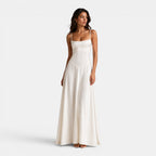 Woman wearing a white dress on a white background