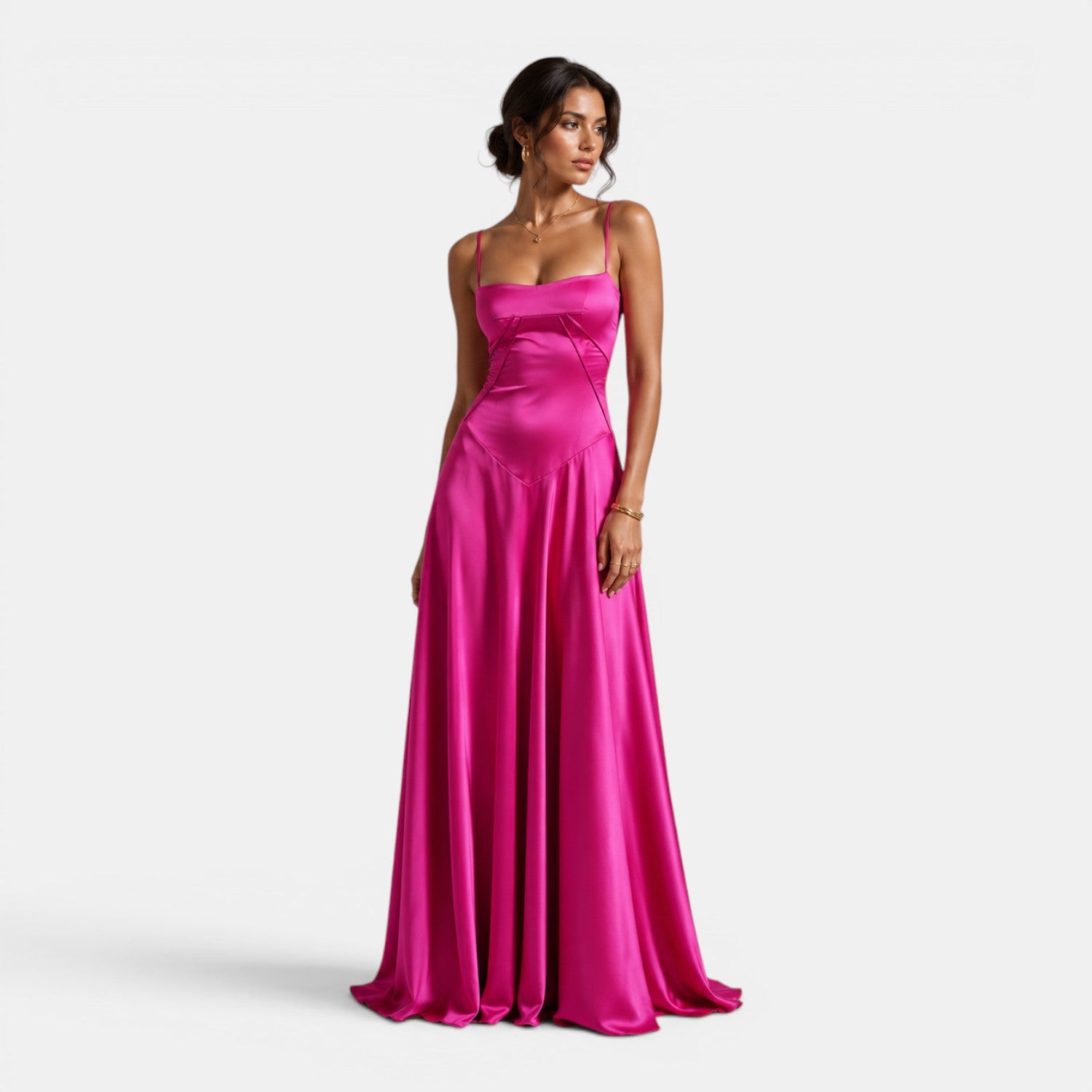 Woman wearing a pink strapless gown on a white background