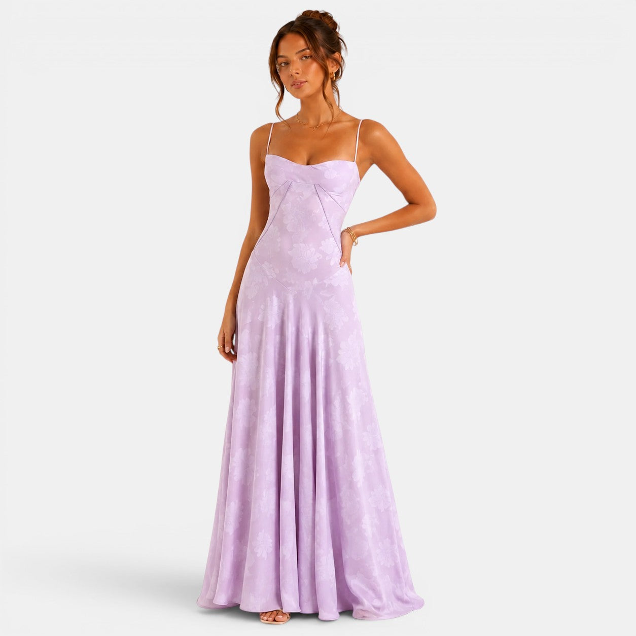 Woman wearing a lavender evening gown on a white background