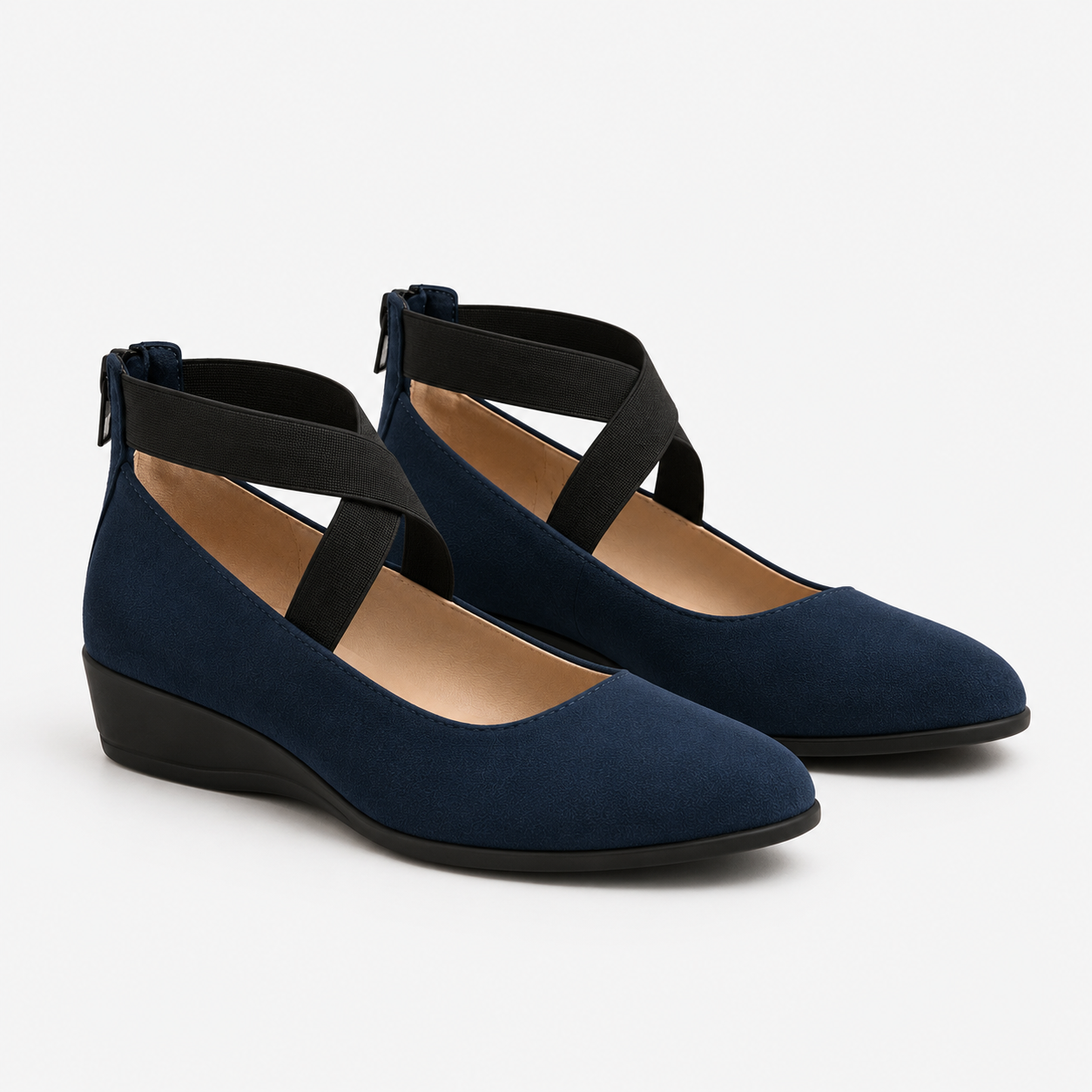 A pair of navy blue suede wedge shoes with black elastic ankle straps, shown on a light gray background.