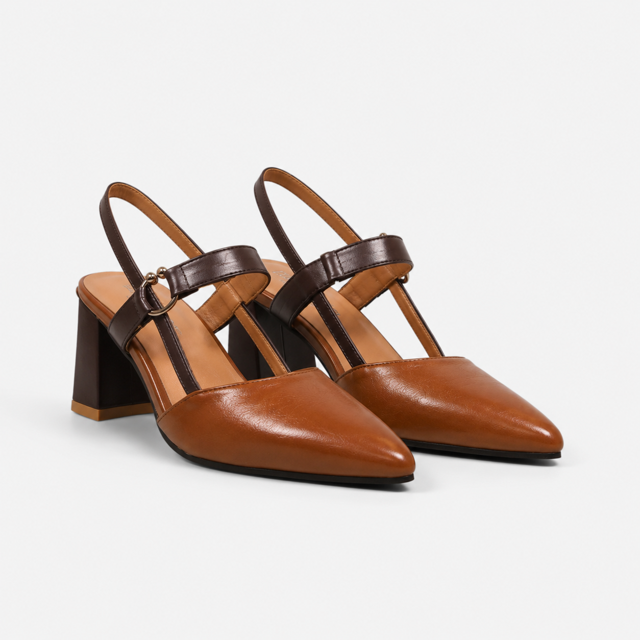 A pair of women's slingback block-heel sandals in tan and dark brown leather, featuring a pointed toe and a decorative ankle strap with a small gold-tone ring, set against a light gray background.