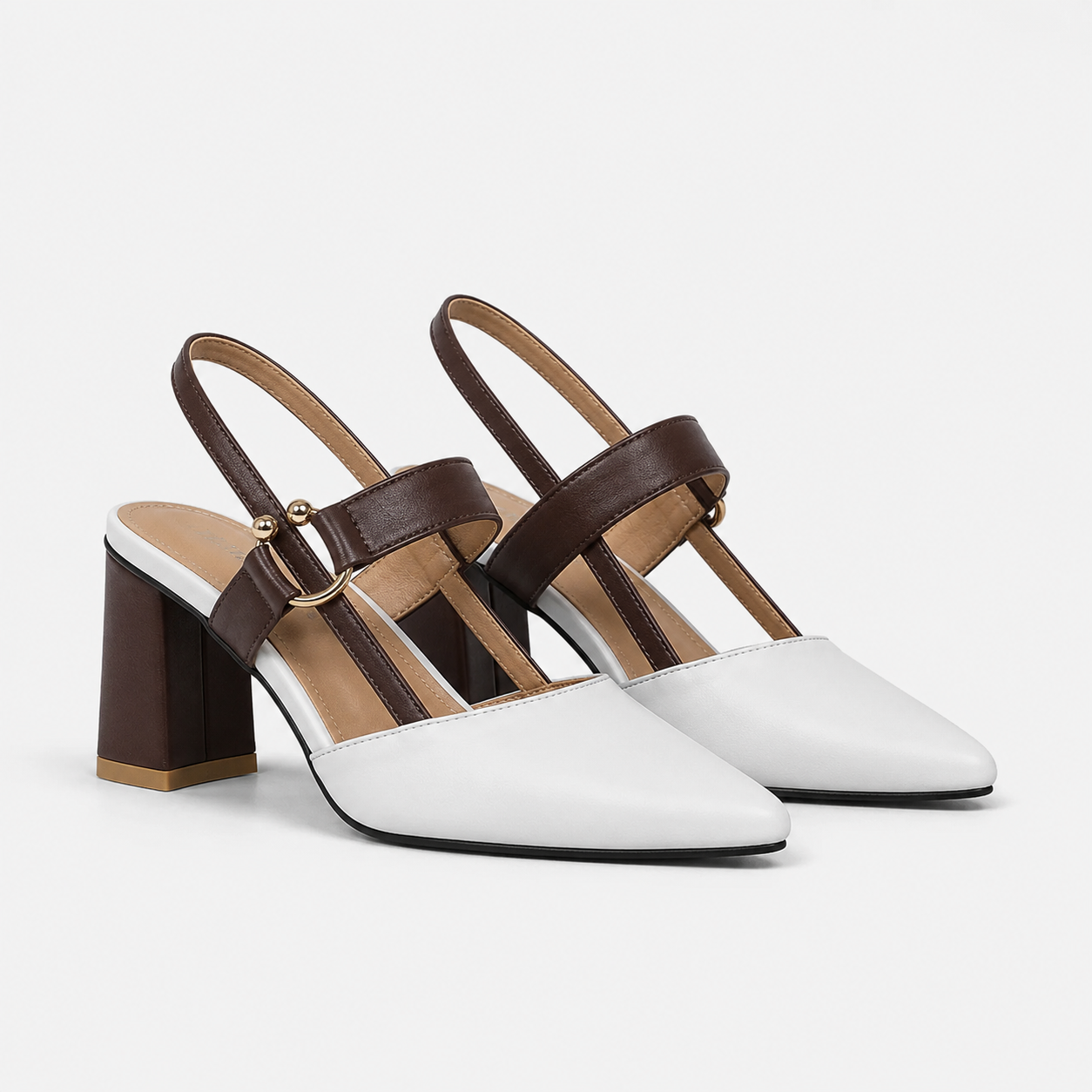A pair of women's slingback block-heel mules with a white toe and upper back strap, and a dark brown leather T-strap and block heel, shown on a light gray background.
