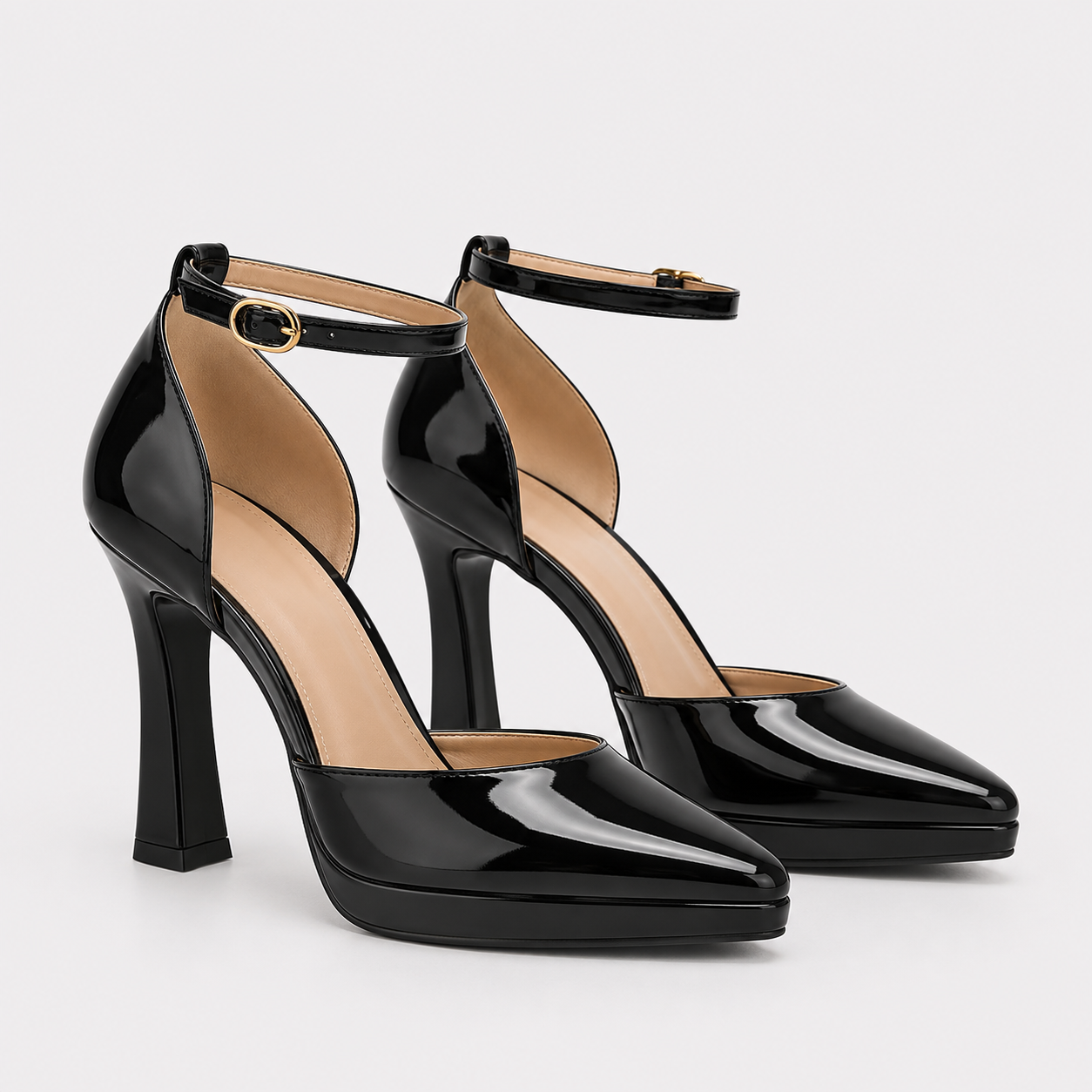 A pair of black patent leather high-heeled pumps with ankle straps and gold-tone buckle details, displayed on a light gray background.